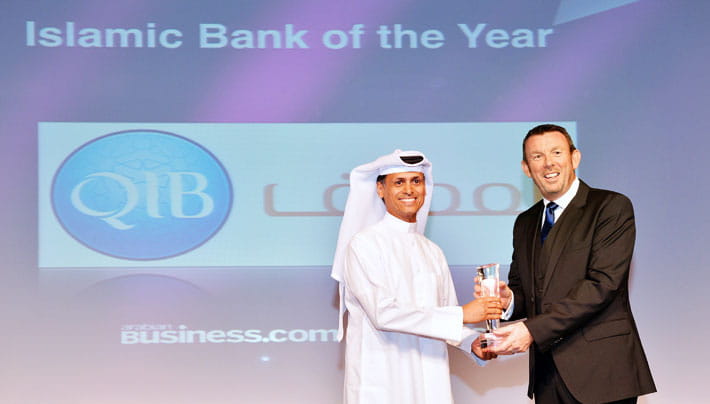 Photo showing award presentation to a senior executive.