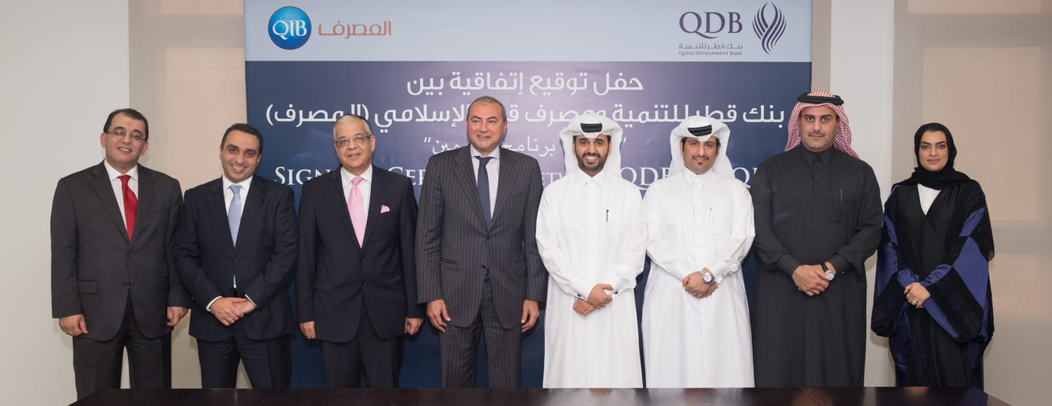 Photo showing agreement signing with development bank.