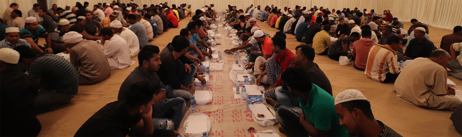 Banner announcing sponsorship of an iftar project with a charity partner.