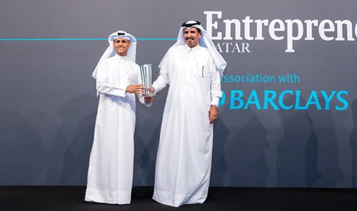 Photo of corporate banking head receiving an award.
