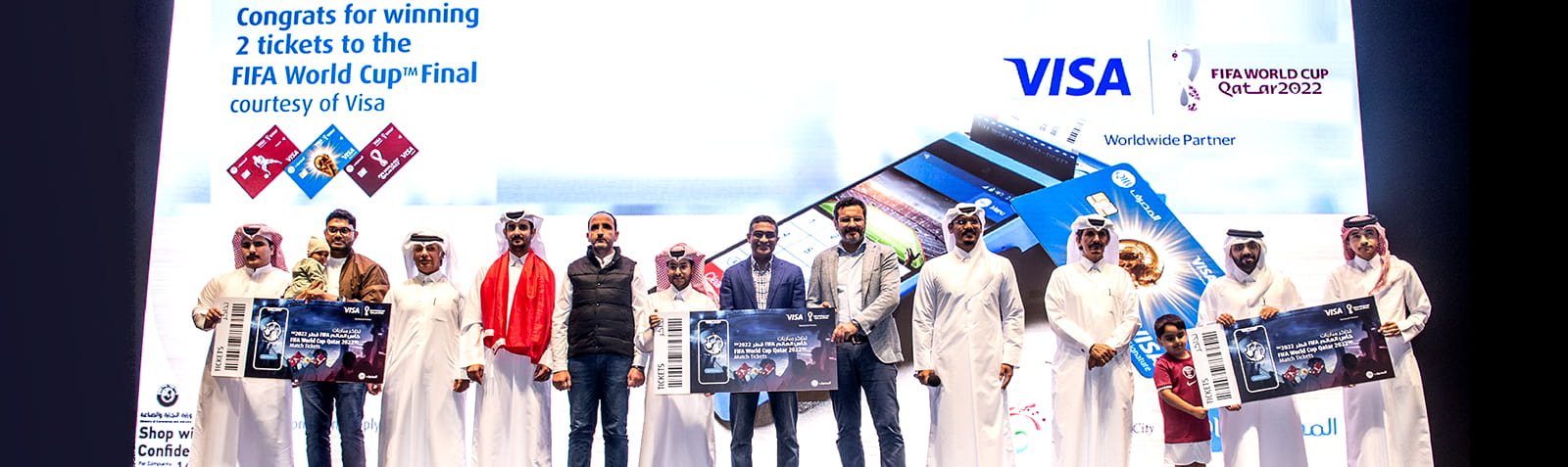 Home banner showing winners group photo with ticket announcement.