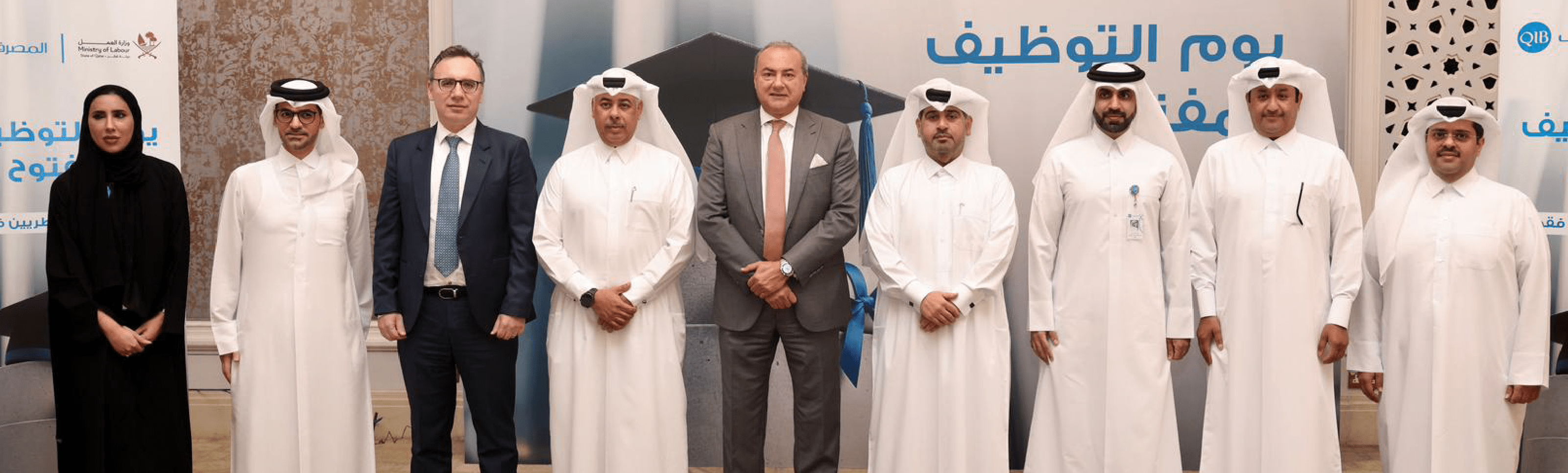 Group of executives standing side by side indoors during an official meeting.