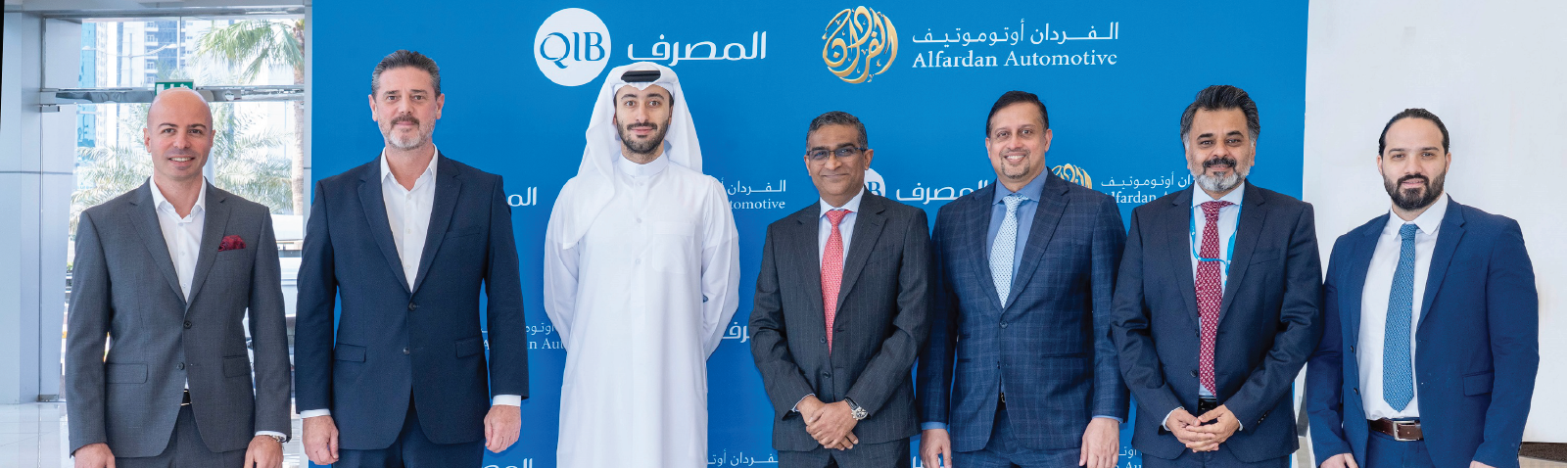 Banner announcing partnership between Qatar Islamic Bank and Alfardan